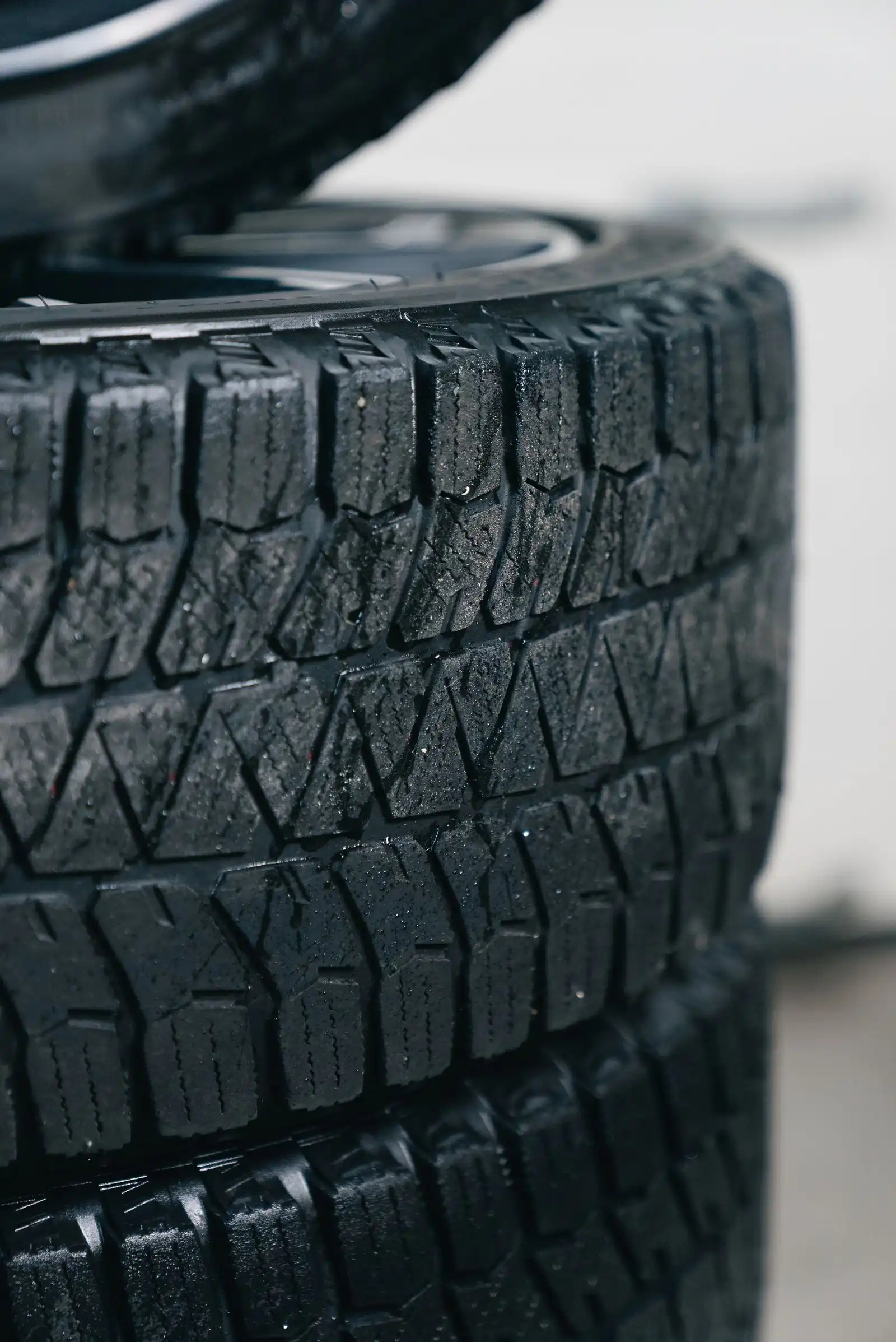 Stack of winter tires showing tread patterns